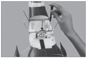 a hand holding an object in his hand